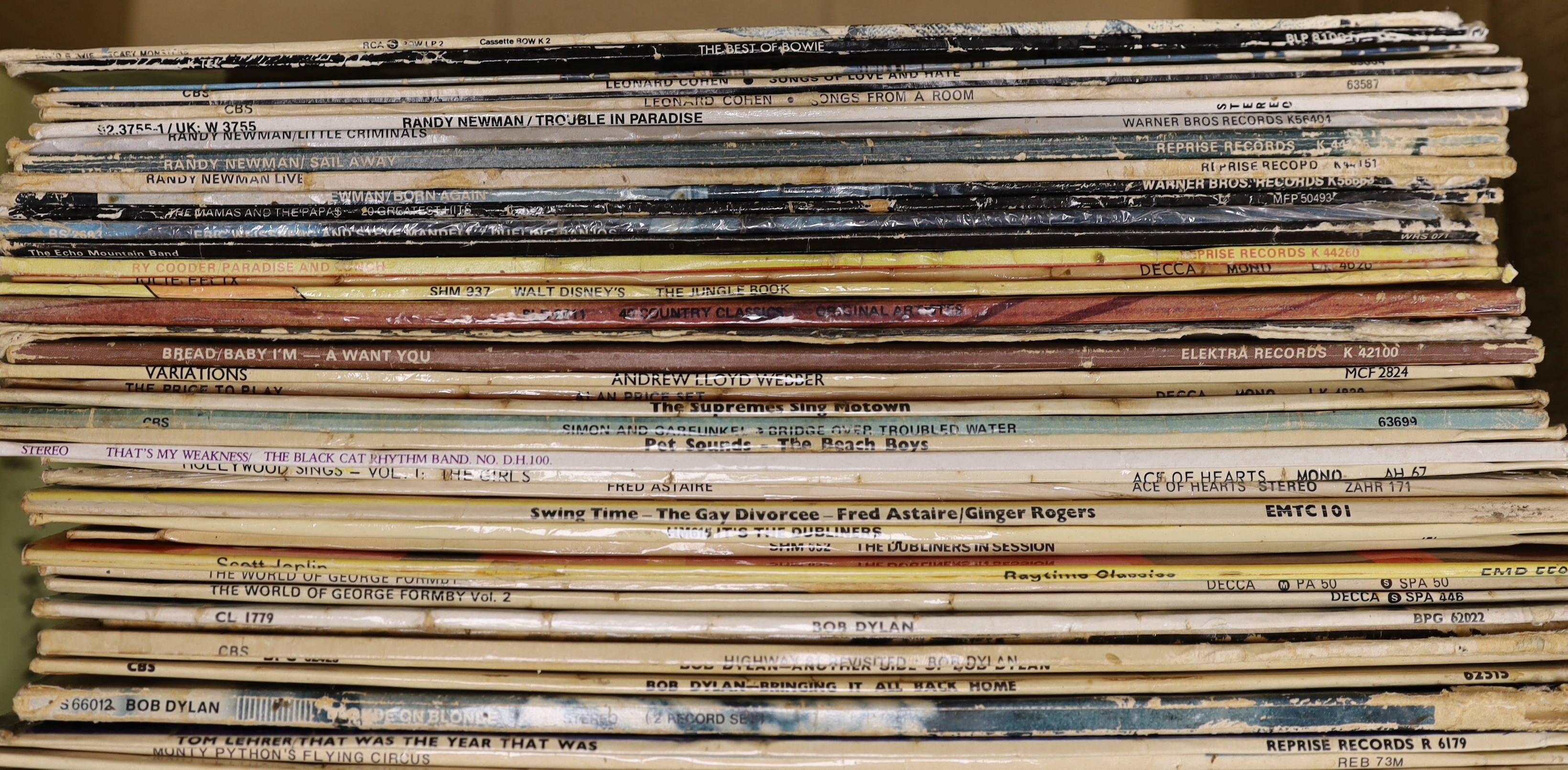 Fifty mainly 1970s LPs, including David Bowie, Leonard Cohen, Randy Newman, Bob Dylan, Simon & Garfunkel, and a number of comedy etc LPs, including Monty Python, Peter, Sellers, Private Eye, etc